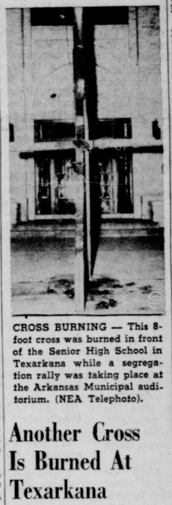 Clipping of a newspaper article with the headline, “Another cross burned at Texarkana.” Above the headline is a black-and-white photo of the large, charred cross outside a Texarkana school.